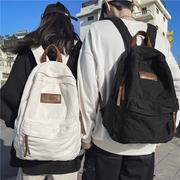 香港港风水洗帆布书包女双肩旅行包男大学生简约复古背包