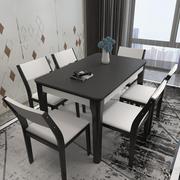 现代简约火烧石餐桌椅组合小户型实木4人6人长方形大理石饭桌黑白