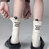 UINXX潮牌小众设计后跟标签字母袜子男女情侣中筒袜ins潮网红棉袜