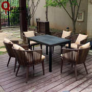 户外藤编椅实体木餐桌，台椅组合室外庭院露台，酒店花园咖啡房地产