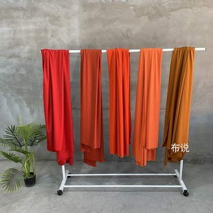 橘黄色桔红色系直贡，呢薄款四面弹力垂坠布料，春夏柔软设计面料
