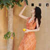 茶歇法式橘色碎花荷叶边吊带连衣裙女2024夏季修身度假风气质长裙