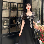 系带蝴蝶结格子拼接方领小黑裙子夏季轻熟减龄短袖茶歇连衣裙女