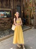 法式黄色吊带连衣裙森女夏季海边度假沙滩，裙露背性感收腰甜美长裙