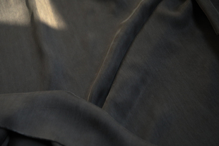 日本进口黑色纯色，砂洗白霜铜氨丝，面料设计师布料服装店