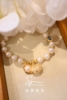 客订欣赏可定制贝壳珍珠手链，足金镶嵌手链