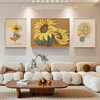 客厅三连装饰画原木风沙发，背景墙挂画高级感奶油，风莫奈向日葵油画