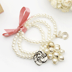 Exportación Chanel / Chanel tela rosa arco de flores de diamantes de resina Pulsera de la perla número 5