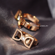 优雅时尚蝴蝶结欧美日韩女戒指饰品，钛钢镀18k玫瑰金锆石(金锆石)个性